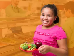 Photograph of a girl with a plate of food