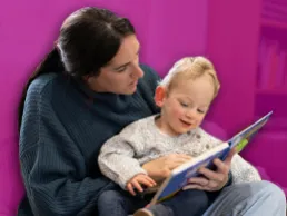 photo of a mom reading to a toddler boy