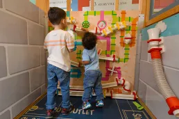 Two children playing a game in storyville