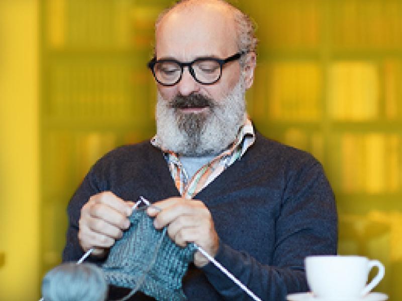 image of a man knitting