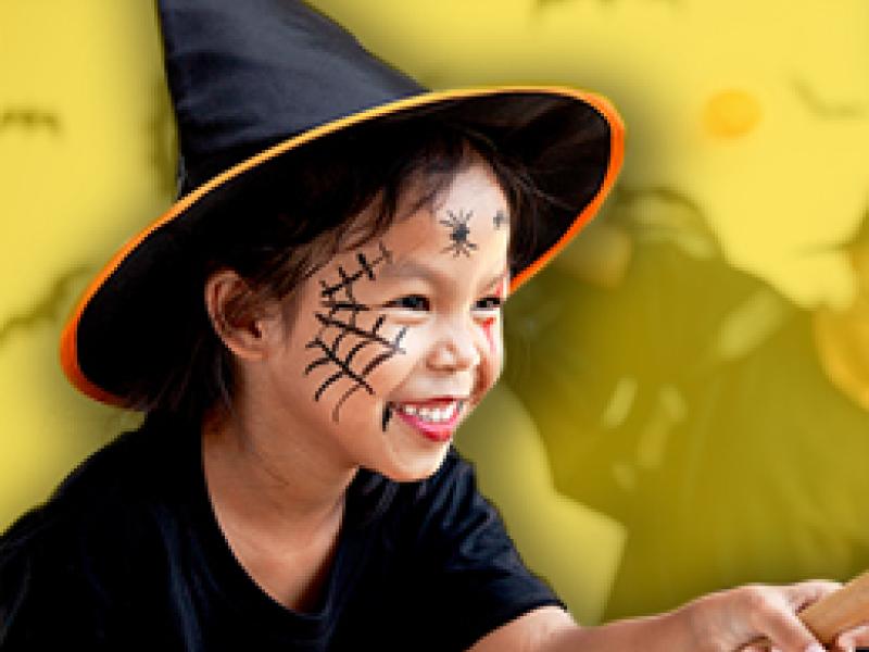 image of a girl dressed as a witch