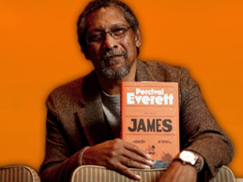 Percival Everett holding his book titled James