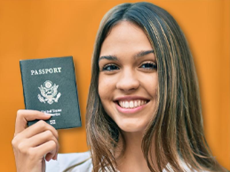a latino woman holding a US passport