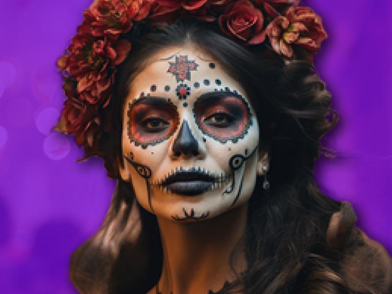 a woman dressed up with Day of the Dead makeup and costume