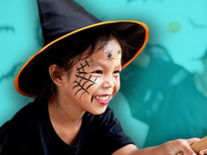 a girl dressed up as a witch for halloween