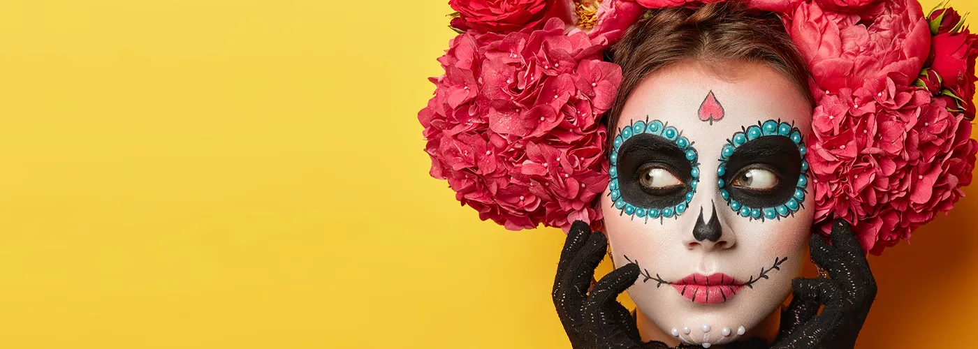 photo of a woman dressed up in day of the dead costume