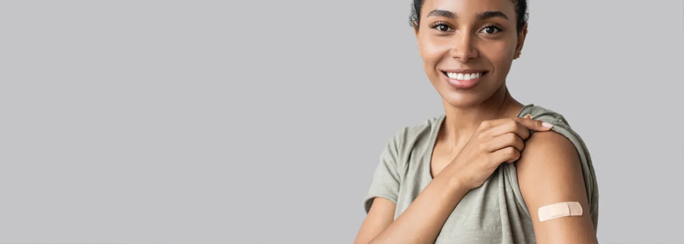 image of a woman with a band aid on her arm