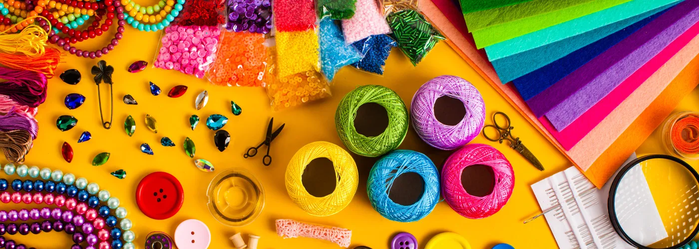 image of various crafting supplies including beads and thread