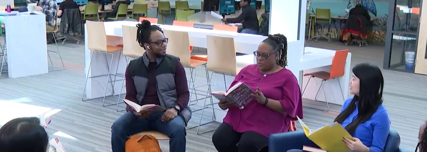 a group of people attending a book club meeting