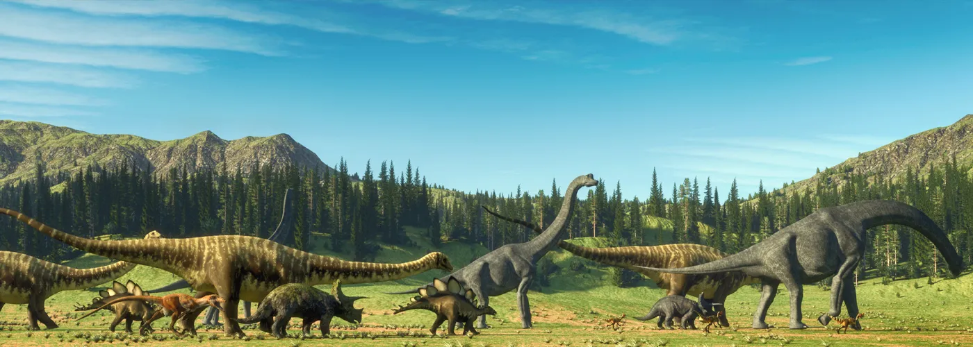 dinosaurs walking across a plane with mountains in the background