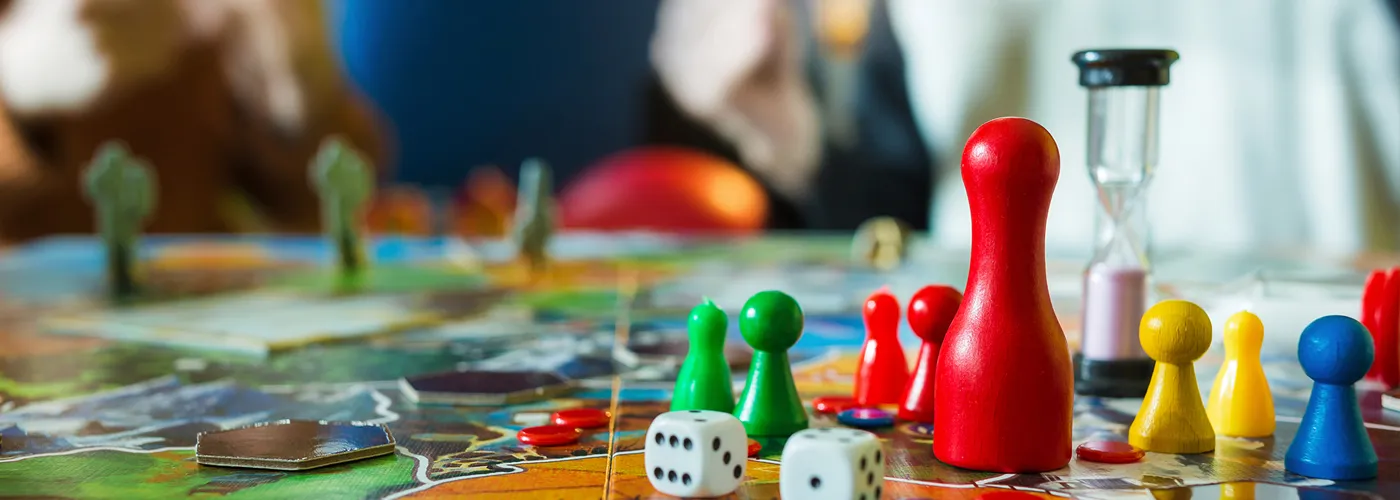 a board game with dice and pawns