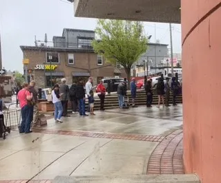 Book sale attendees waiting in line.