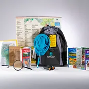 An example of the adventure backpack and some of the items included such as a magnifying glass, dip net and pocket guides.