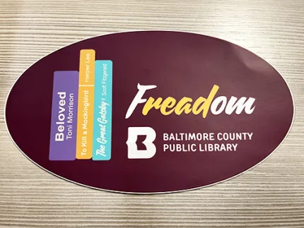 Freadom - Baltimore County Public LIbrary graphic on an oval sticker