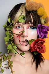 Art of a person with flowers surrounding their face